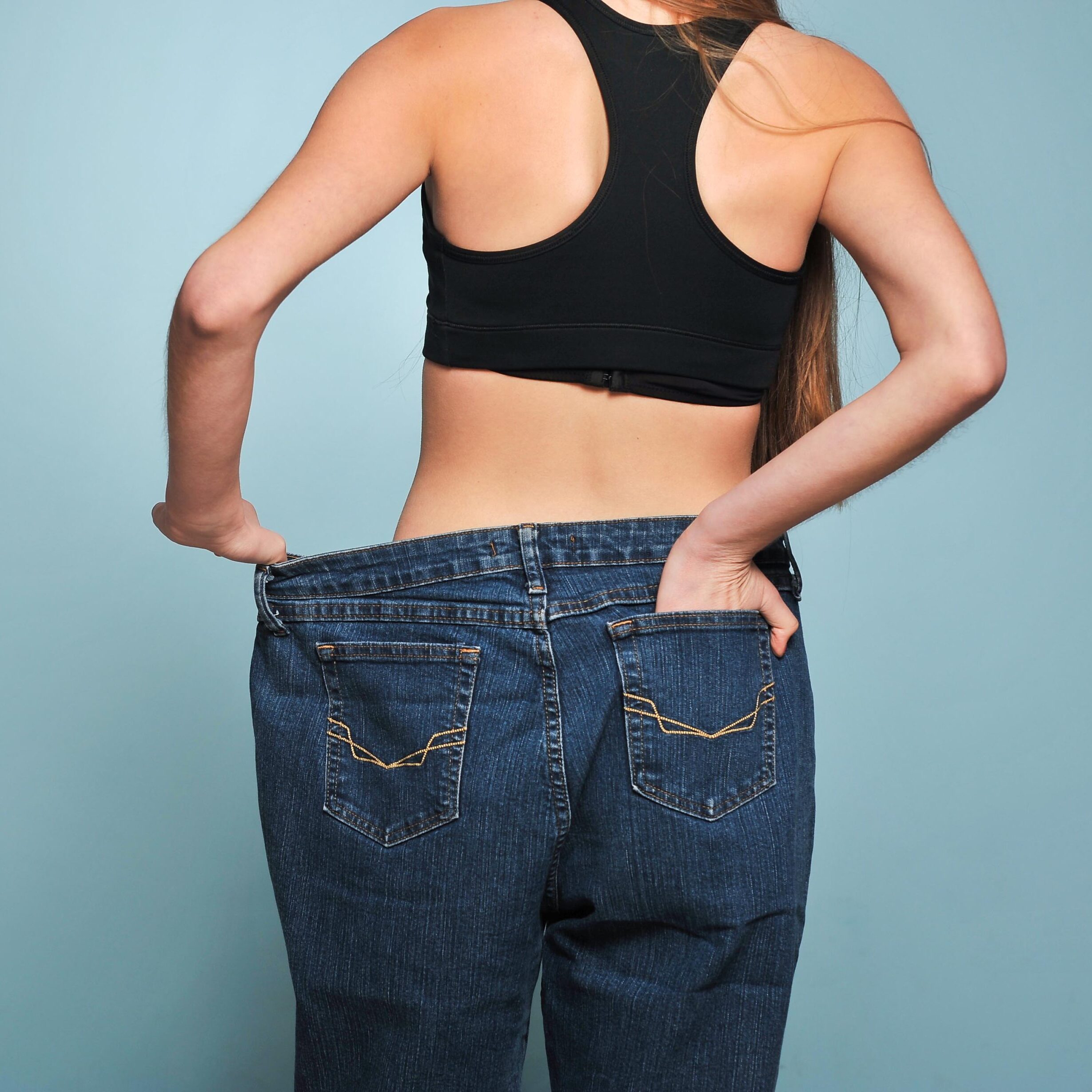 Women shows her weight loss from semaglutide weight loss injections in Ogden, Utah.